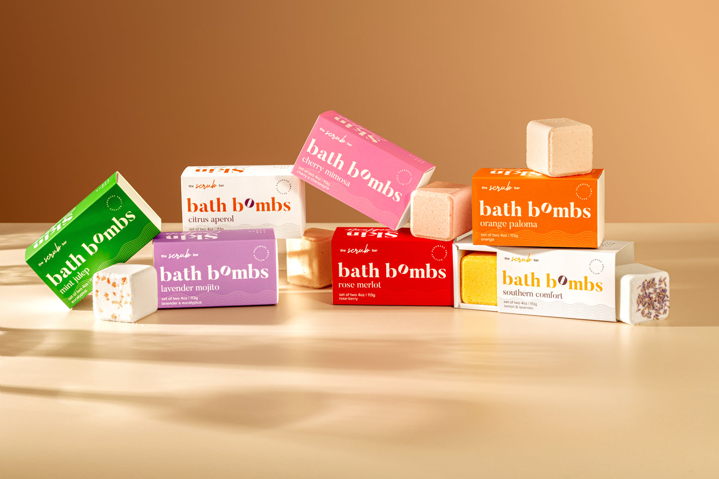 Colorful bath bomb gift sets from The Scrub Bar, boxed for holiday gifting, birthdays, or spa-inspired self-care.