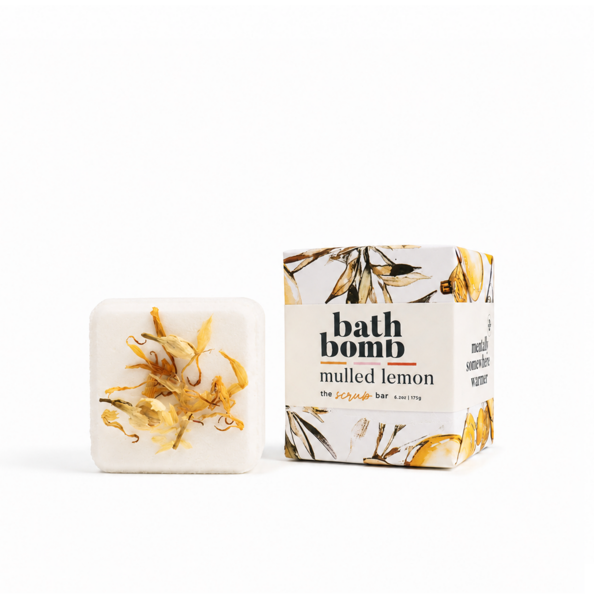 Mulled Lemon botanical bath bomb with botanical flowers beside illustrated The Scrub Bar packaging
